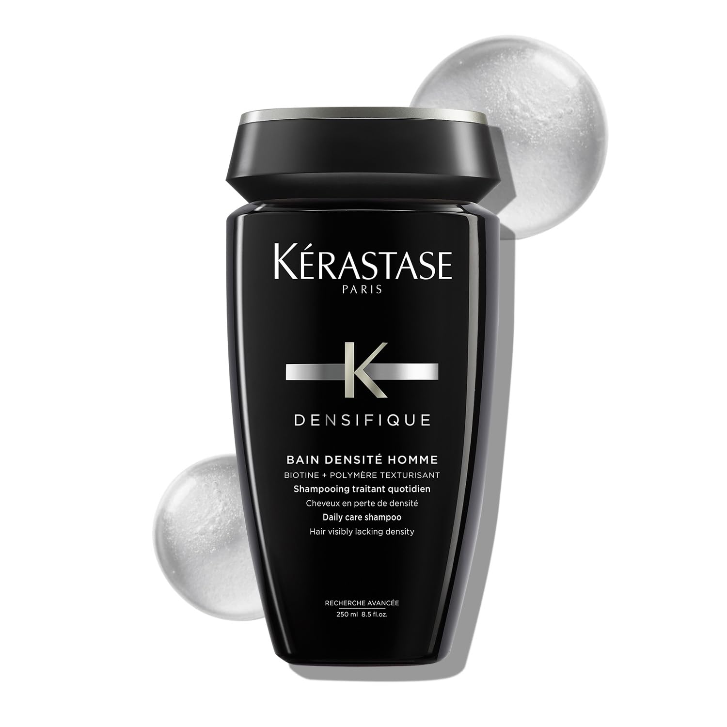Kérastase densifique shampoo for men in a sleek black bottle for daily hair care and increased density