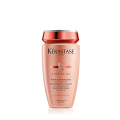 Kérastase Discipline sulfate-free shampoo in a pink bottle for smooth and shiny hair