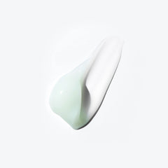 Kerastase hydrating hair mask creamy texture on a white background for intensive hair moisture