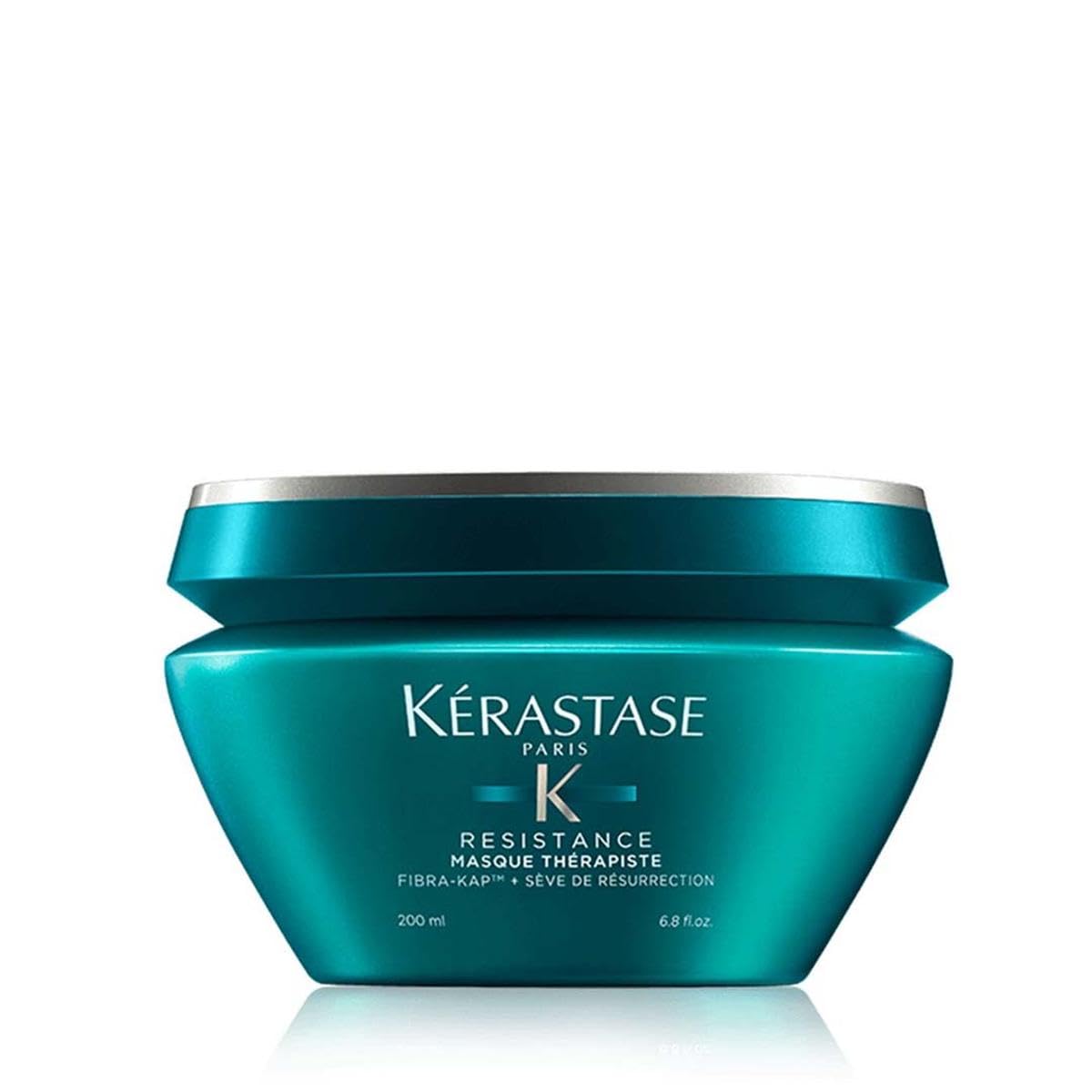 Kérastase Resistance hair mask in a teal jar, designed to restore damaged hair with nourishing ingredients