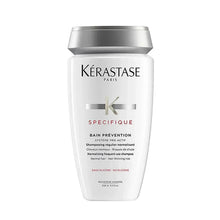 Kérastase shampoo bottle, white with silver cap and Specific label