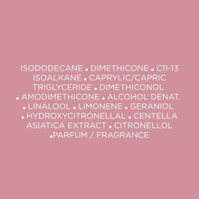 Hair oil ingredient list card with white text on solid pink background