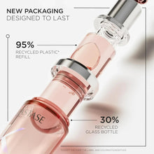 Refillable hair oil refill bottle with rose-pink liquid, clear glass dropper-style top