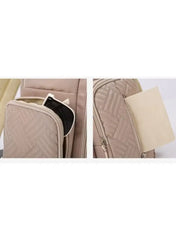 Close-up of the khaki baby travel bag with quilted pattern and convenient storage pockets