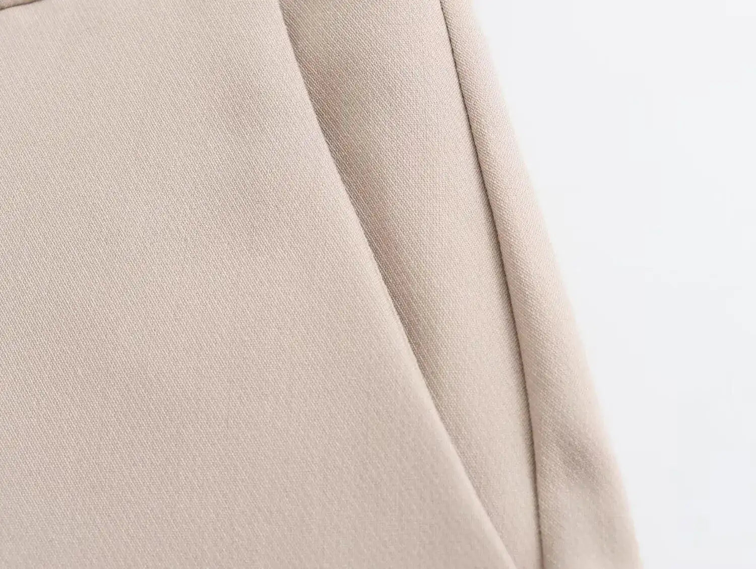 Close-up of khaki women's suit set fabric showing soft texture and tailored design