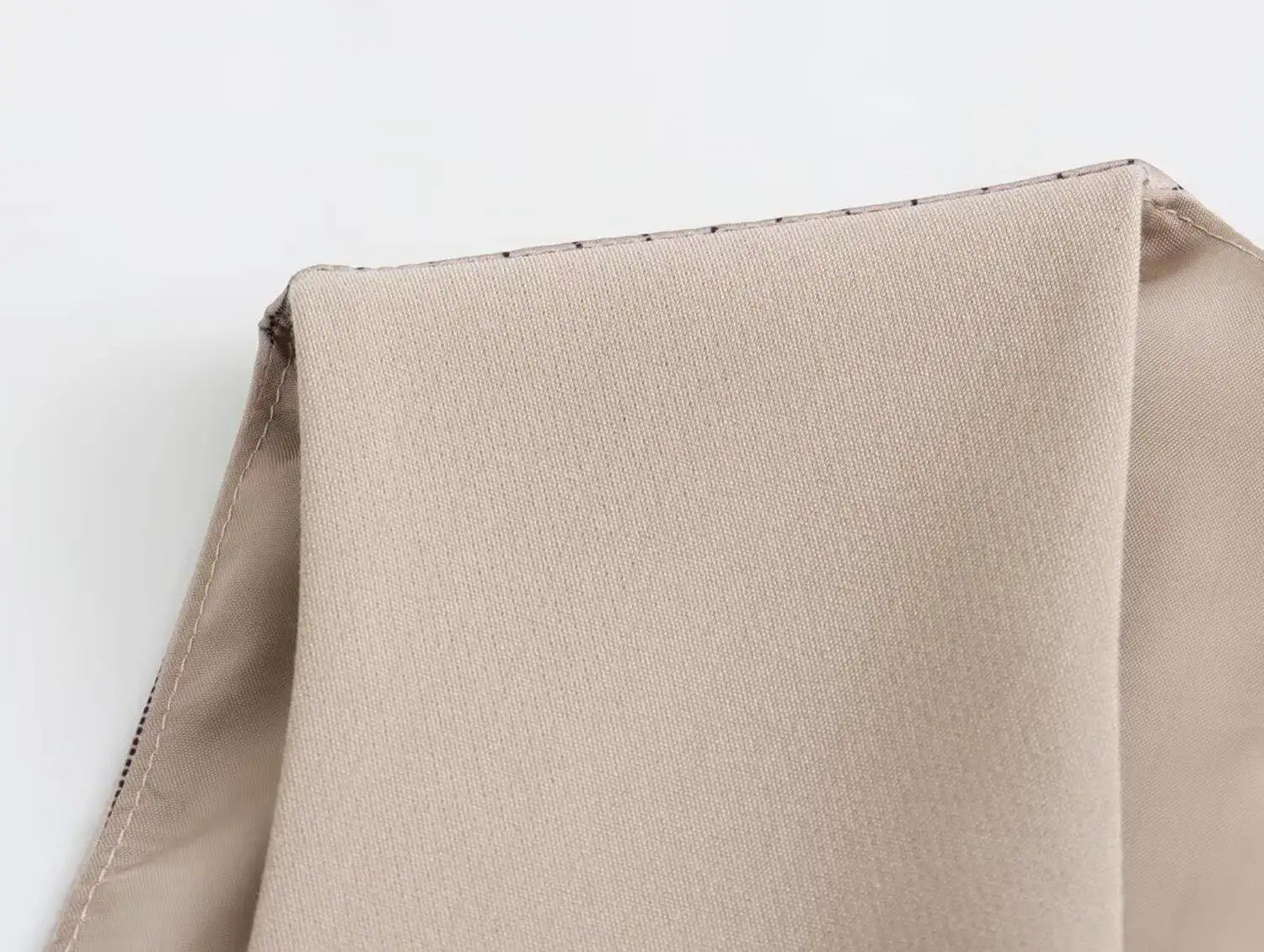 Close-up of fabric texture showing a khaki women's suit set from Mumzar