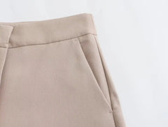 Close-up of Khaki women's suit set pants featuring stylish pockets and a tailored fit