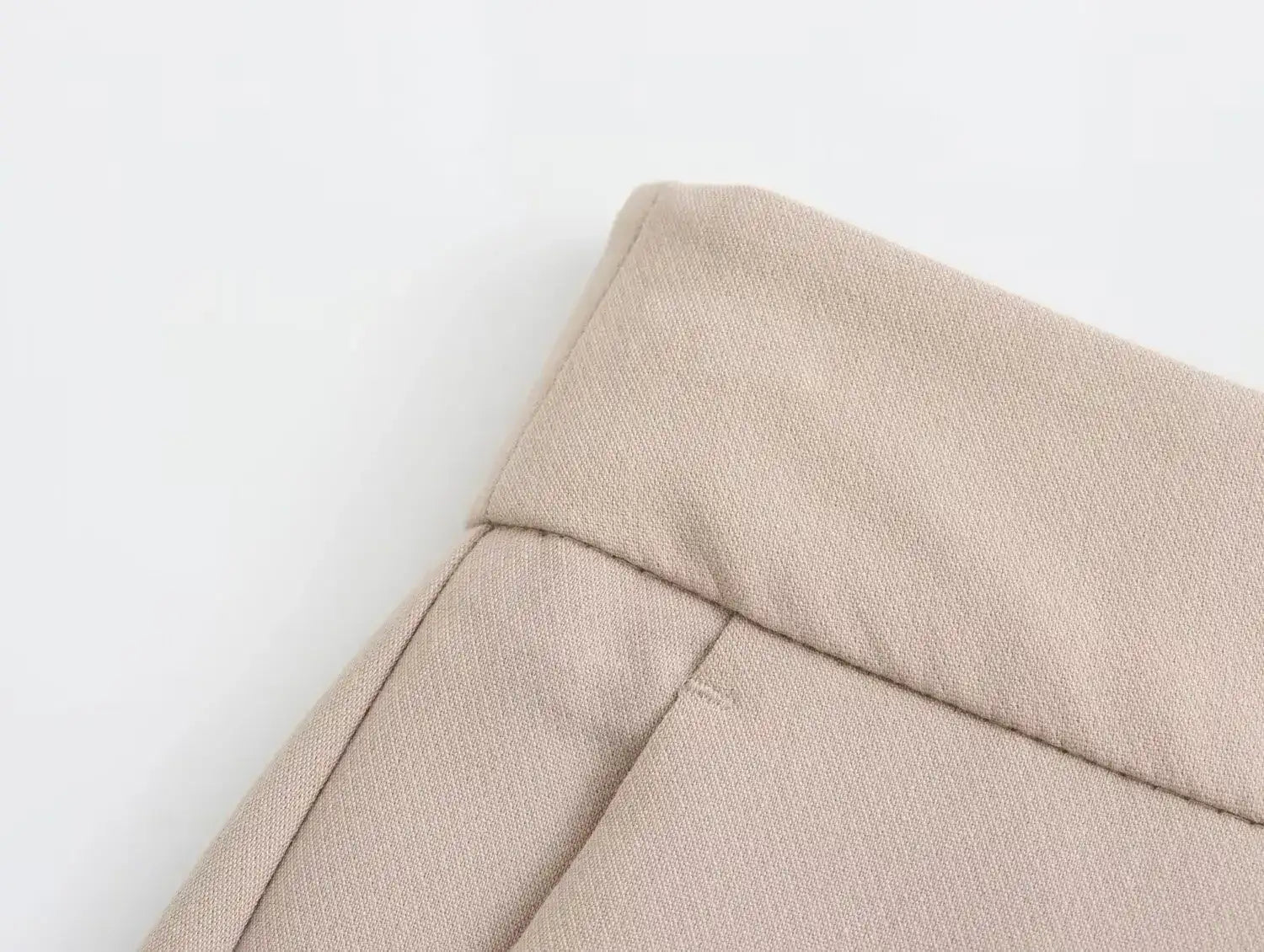 Close-up of khaki women's suit set pants showing high-quality fabric and tailored design