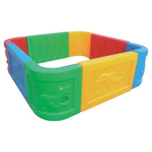 Empty square ball pit with colorful panels and textured corner blocks