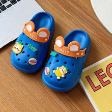 Blue kids cartoon clogs with orange band, front holes, and colorful character charms
