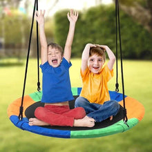 Kids sitting in a hanging hammock swing with orange-green-blue padded seat