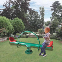 Kids garden seesaw with green frame, red seats, toddler pushing