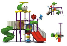 Kids outdoor playset with red slide, green spiral slide, and purple stair rails