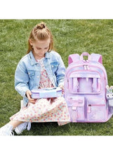 Kids pink backpack with clear front pocket and dangling animal keychain