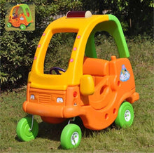 Kids plastic sand car with orange body, green frame, and four green wheels