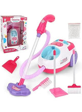 Pink toy cleaning vacuum with hose and cleaning accessories, shown with gift box