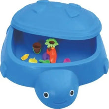 Blue kids sandbox with whale base and hinged lid, toys visible inside.