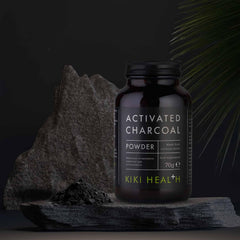 Kiki Health activated charcoal UAE jar of activated charcoal powder 70g on dark stone display