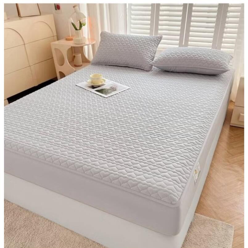 Huitich king size waterproof mattress topper fitted sheet in light gray with quilted texture on bed