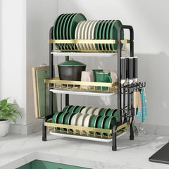 Huitich kitchen drain bowl and rack set with three-tier black and gold frame holding plates, bowls, mugs, and utensils