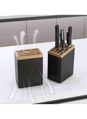 Huitich stainless steel knife rack with wooden top holding various kitchen knives on white countertop