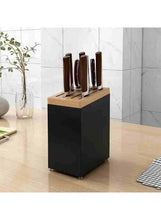 Black knife storage block with wooden top and stainless steel knife slots