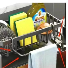Stainless steel sink rack with towel bar and spaced wire slots for utensils