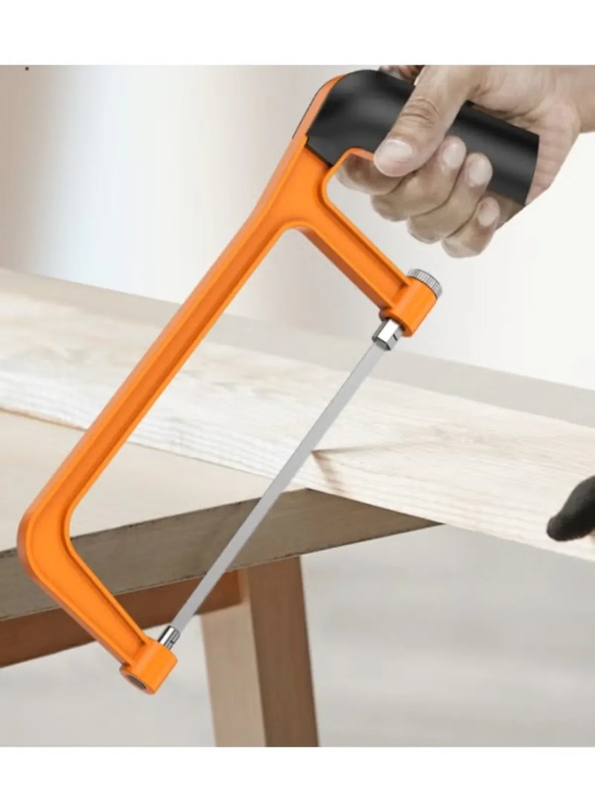 Orange-and-black staple remover tool pulling staples