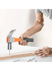 Claw hammer with orange grip driving a nail into wood