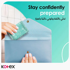 Kotex Antibacterial panty Liners teal single wrapped liner being placed into small purse for travel