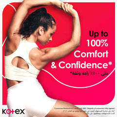 Kotex mini tampons UAE advertisement with athletic woman stretching in white activewear and bold red background