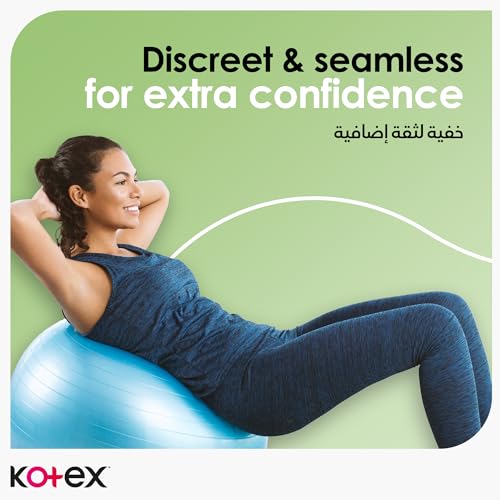 Active woman in navy workout clothes on a blue exercise ball advertising Kotex natural ultra thin pads for discreet protection
