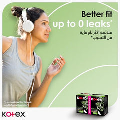 Woman in headphones exercising with Kotex natural ultra thin pads box shown on green background