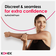 Kotex ultra thin sanitary pads ad showing a smiling woman stretching her arm with discreet and seamless confidence tagline