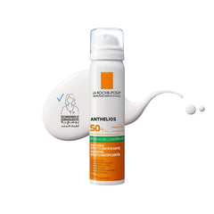 La Roche-Posay Anthelios sunscreen SPF 50 UAE in a spray bottle with a smooth sunscreen texture shown on a surface
