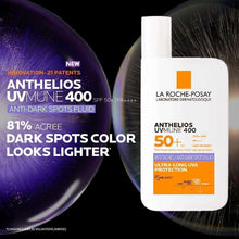 Anthelios UVmune 400 SPF 50+ anti-dark spots fluid bottle with droplets.