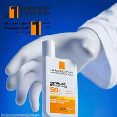 La Roche-Posay Anthelios UVMune 400 sunscreen SPF 50+ in a hand with light background for sun protection