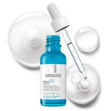 La Roche-Posay Hyalu B5 face serum bottle with dropper over white gel swirls