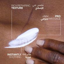 Lotion tube with cream smear on skin, white with blue label