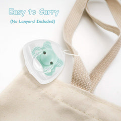 LODROC pacifier holder case with translucent shell and green pacifier sitting on beige tote strap