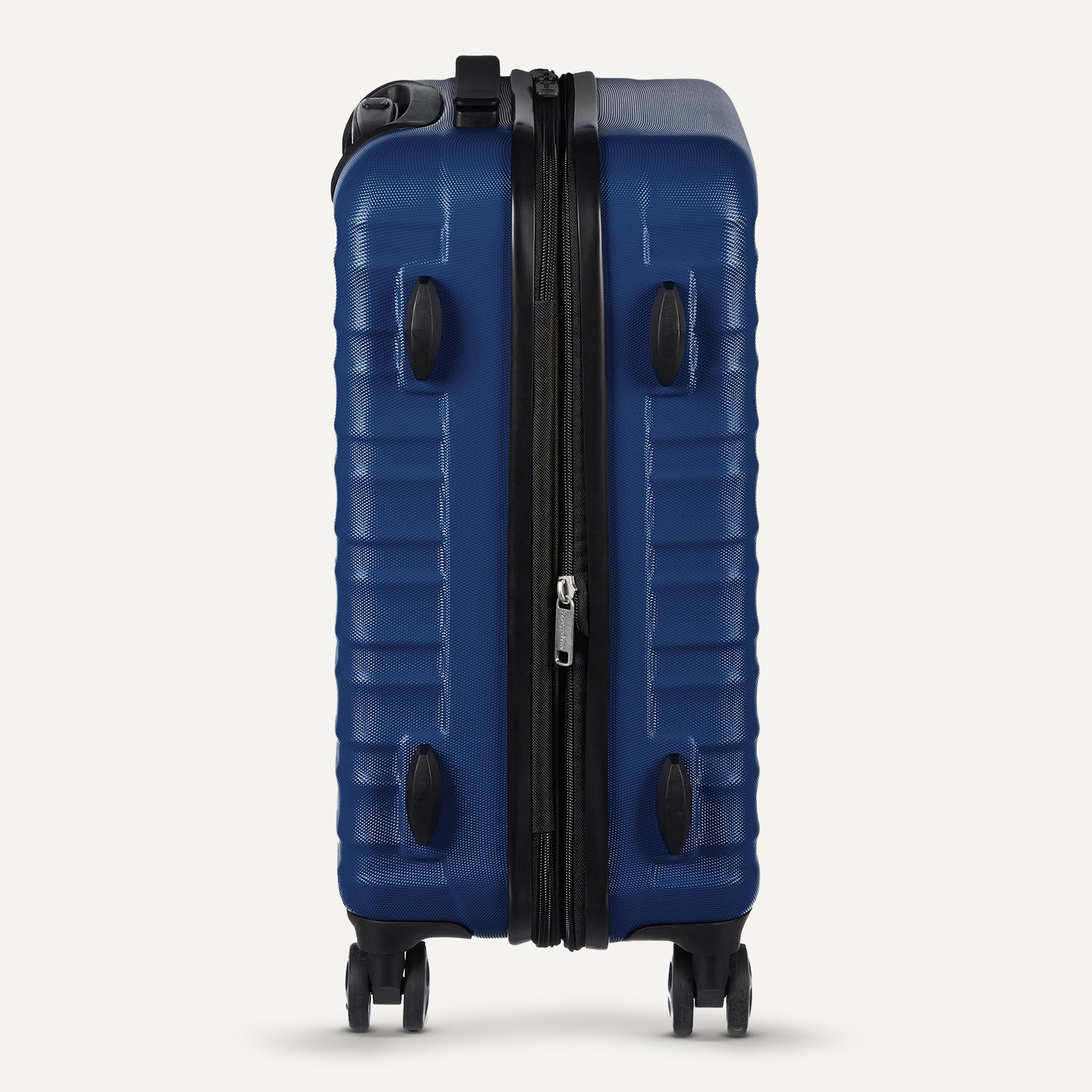 Side view of large ABS luggage navy blue with four spinner wheels and black zipper