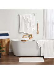 Large White Bath towel 70x140 cm 470g hanging on rack and draped over bathtub in modern bathroom