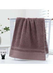 Huitich towel set featuring large white bath towel 70x140 cm 470g in soft brown color hanging on white rack