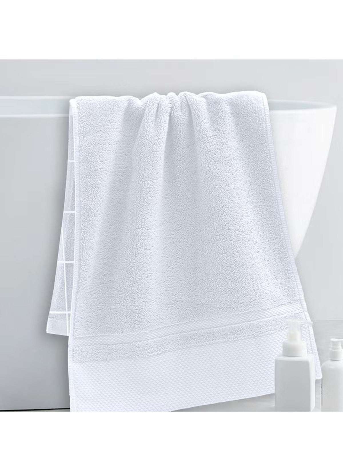 Huitich large white bath towel 70x140 cm 470g hanging on bathtub edge in bright bathroom