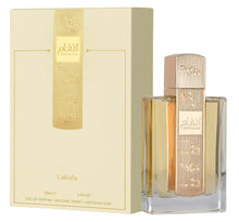 Eau de parfum bottle with gold cap and cream box, clear glass