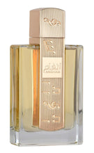 Eau de parfum bottle with ribbed gold cap and clear amber glass