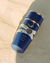 Men's eau de parfum bottle, blue with gold-toned cap and silver ASAD badge