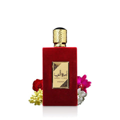 Lattafa Asdaaf Ameerat Al Arab perfume 100ml in elegant red velvet bottle with gold cap and floral accents