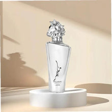 Perfume bottle with silver horse cap and clear glass, on white display stand