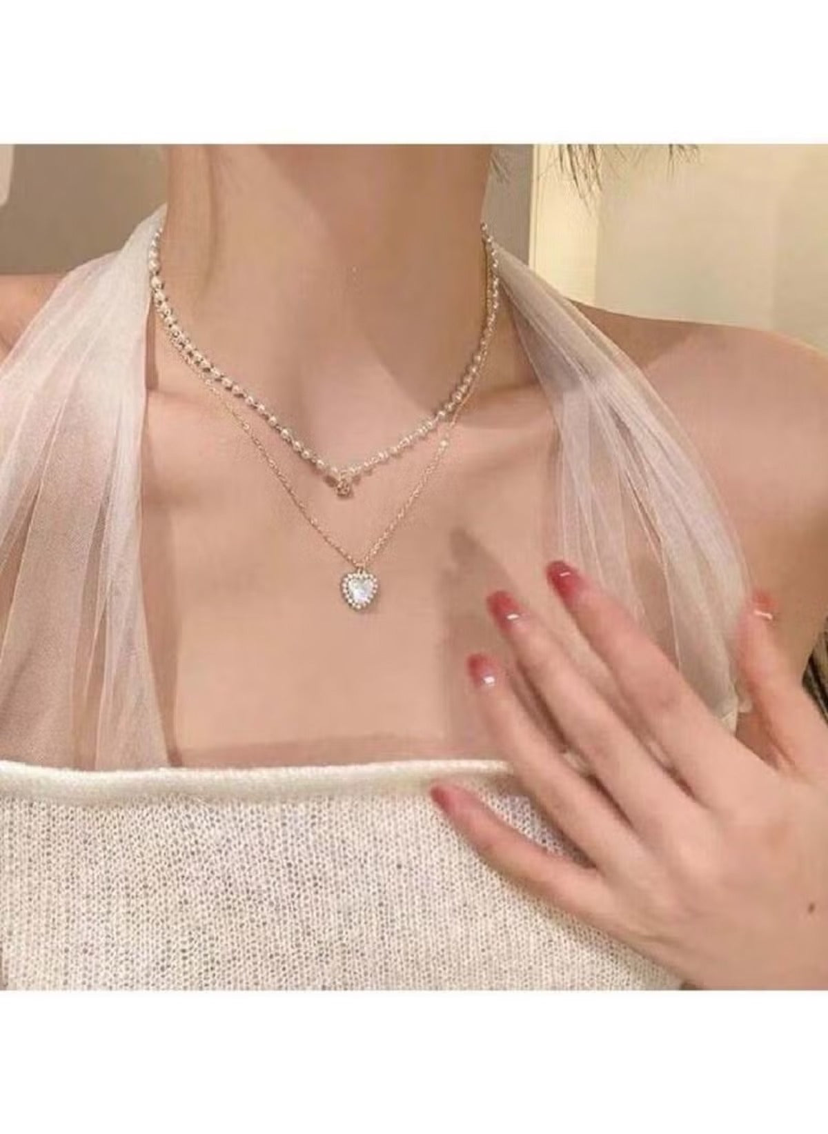 Huitich layered pearl pendant necklace with delicate chains and heart-shaped pendant on model